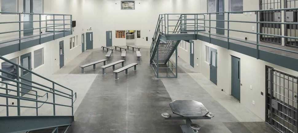 Upper-level view across a Mule Creek State Prison dayroom